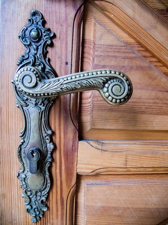 The classic brass handle gives the door an understated vintage appeal.